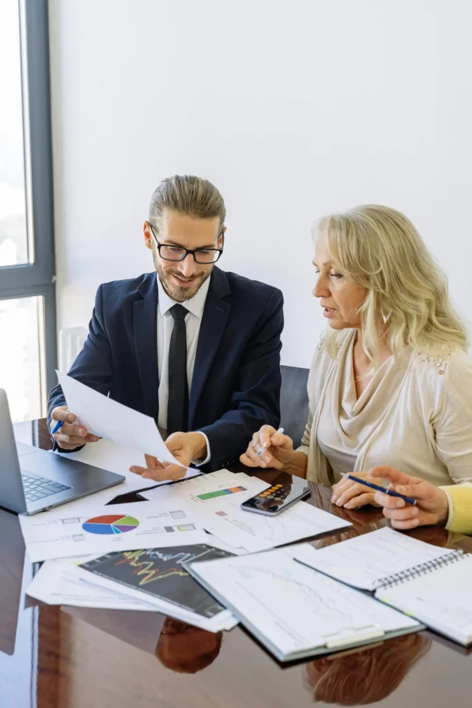 Advisor discussing account receivable management reports with client at Predawn Accounting
