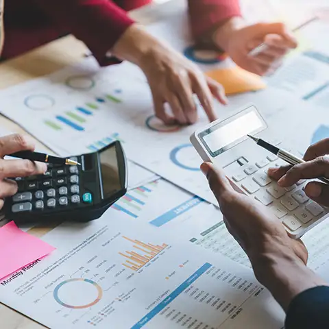 Team working on QuickBooks setup and financial reports