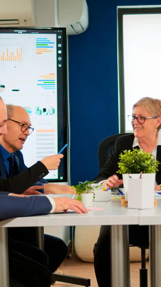 Business executives analyzing data on account payable management in a corporate setting