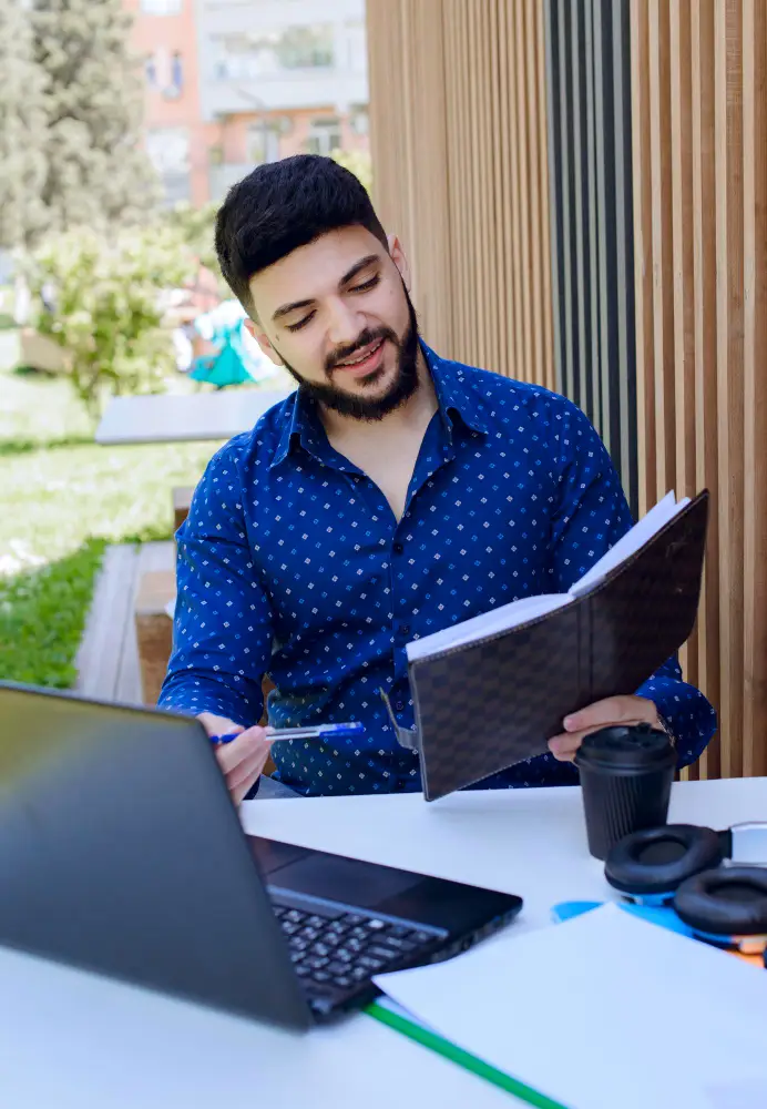 Professional reviewing QuickBooks data on a tablet