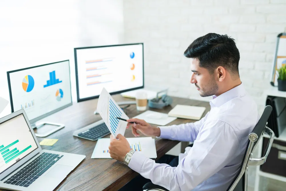 Analyst reviewing reports for Fractional CFO Services