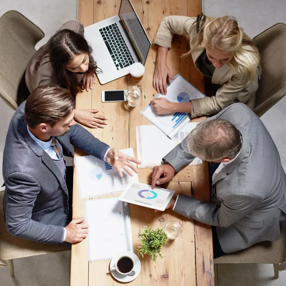 Business team reviewing reports for Fractional CFO Services