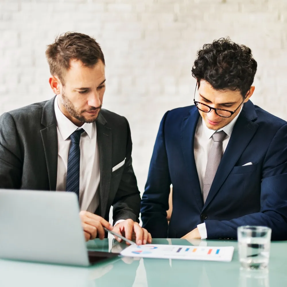 Financial advisors discussing Fractional CFO Services plan