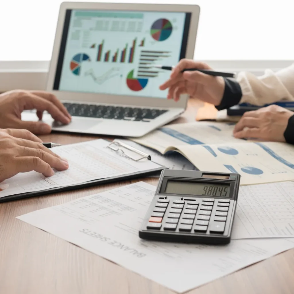 Financial advisory meeting with charts and calculator