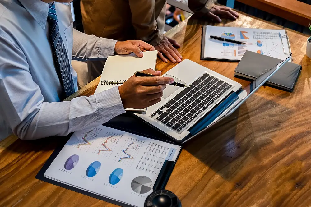 Financial modelling services on laptop with charts