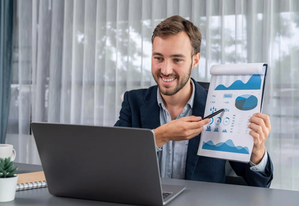 Smiling analyst presenting financial report for Fractional CFO Services benefits