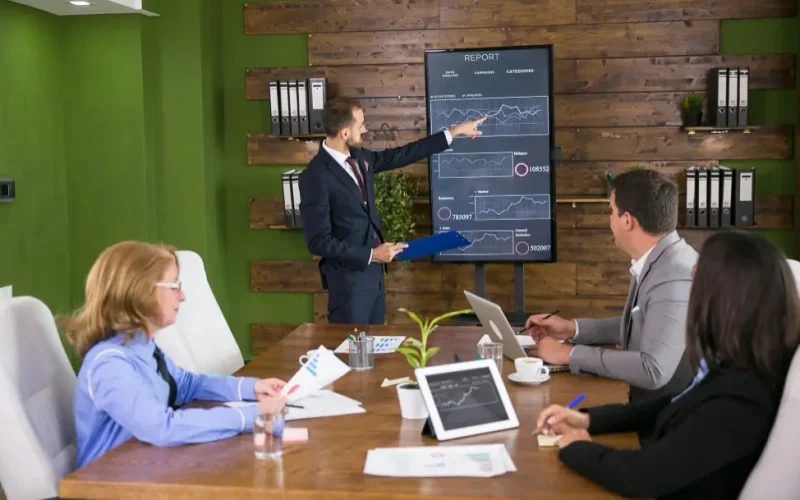 Business team reviewing dashboards using Power BI consulting services