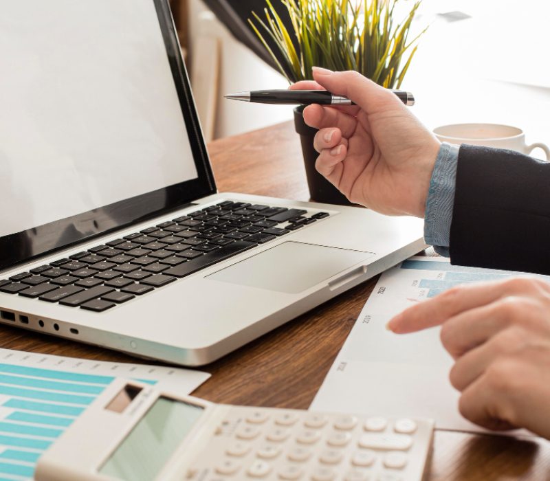 Checking financial data and accounting services on laptop at Predawn Accounting