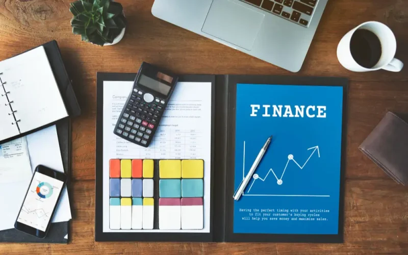 Desk setup showing account payable management at Predawn Accounting