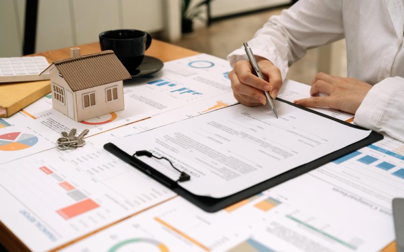 Signing financial documents for accounting services management at Predawn Accounting