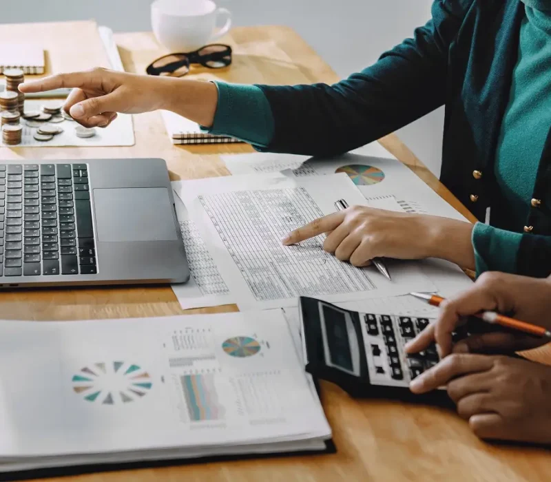 bookkeeping for startups reviewing financial reports and calculations at Predawn Accounting
